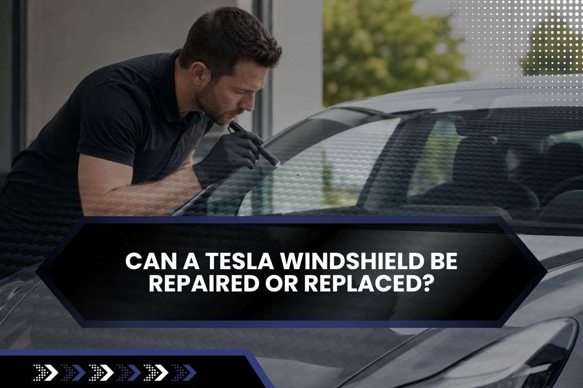 Technician inspecting whether a Tesla windshield can be repaired